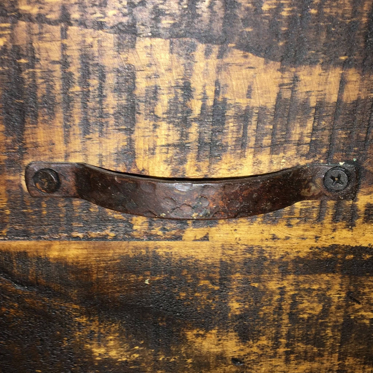 Rustic wooden surface with a metal handle