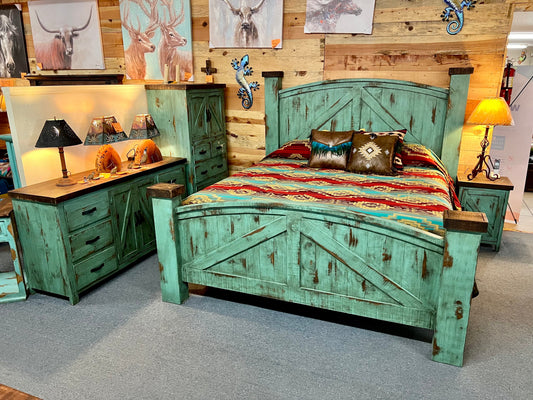 Rustic green bed with decorative pillows in a bedroom setting.
