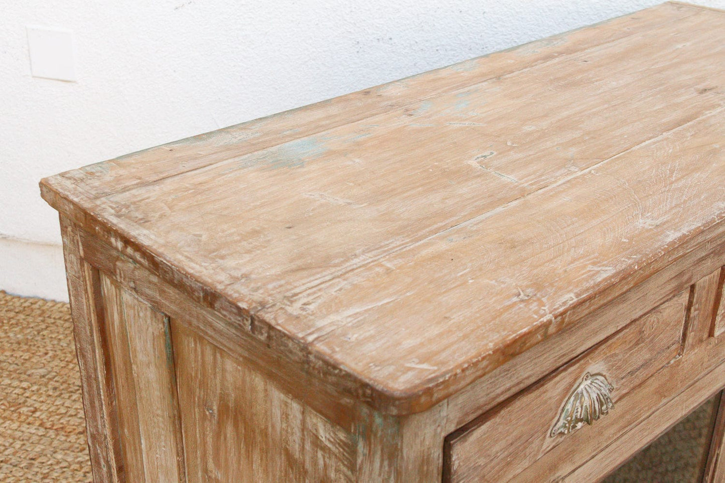 Reverse glass painted buffet cabinet showing rich wood grain and patina