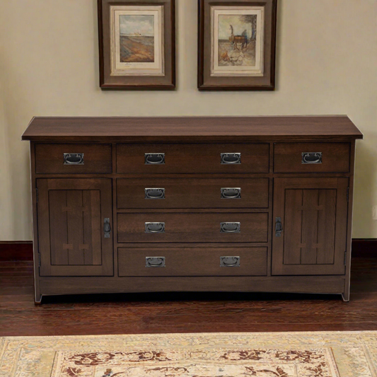 A dark brown wooden dresser with multiple drawers and cabinet doors, styled in a traditional room setting with framed artwork on the wall and a patterned rug on the floor.