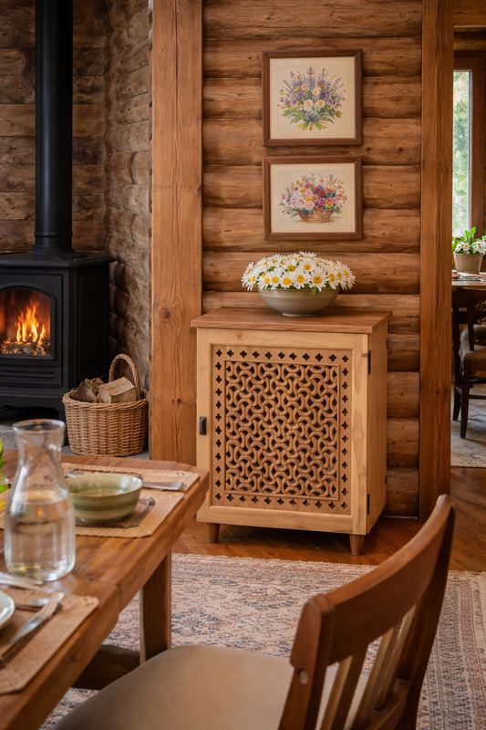 Wooden living room with fireplace, table, chairs, and decorative elements.
