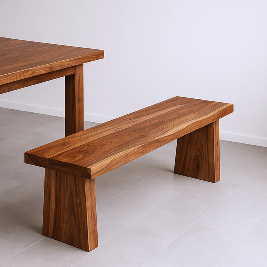 Wooden bench and table set on a light gray floor with a white wall background