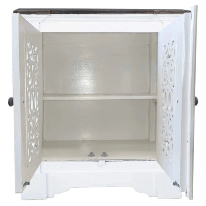 White cabinet with decorative cut-out design on a white background