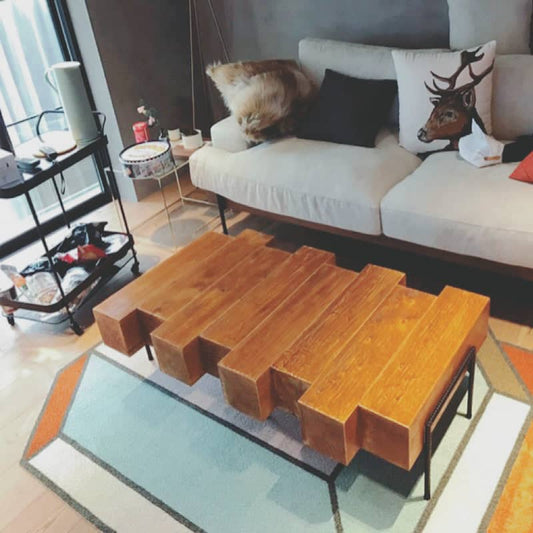 Nordic solid wood coffee table featuring a minimalist design in a modern living room setting.