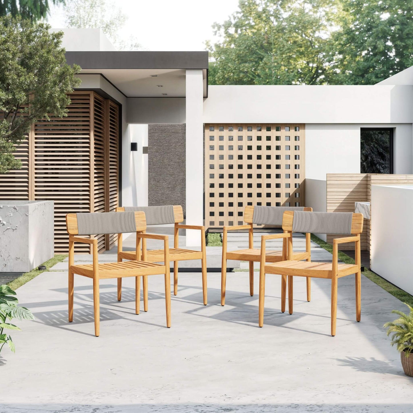 Outdoor patio set with wooden chairs and gray cushions in a modern backyard setting.