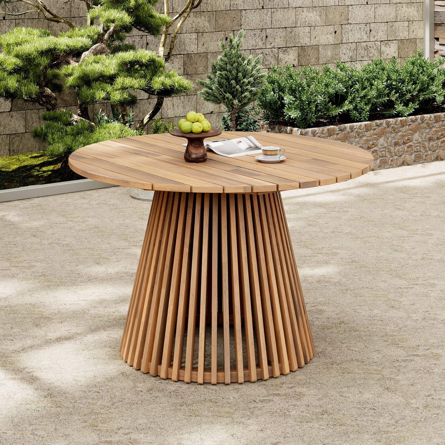 Wooden outdoor table with a textured base in a garden setting