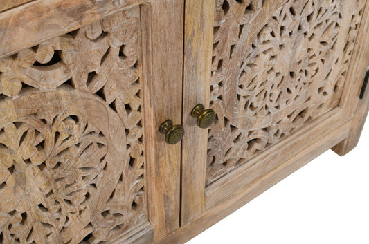 Wooden cabinet with intricate carvings and brass handles on a white background