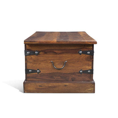Solid Sheesham Wood trunk coffee table with metal accents, showcasing its rich wood grain and handcrafted design.