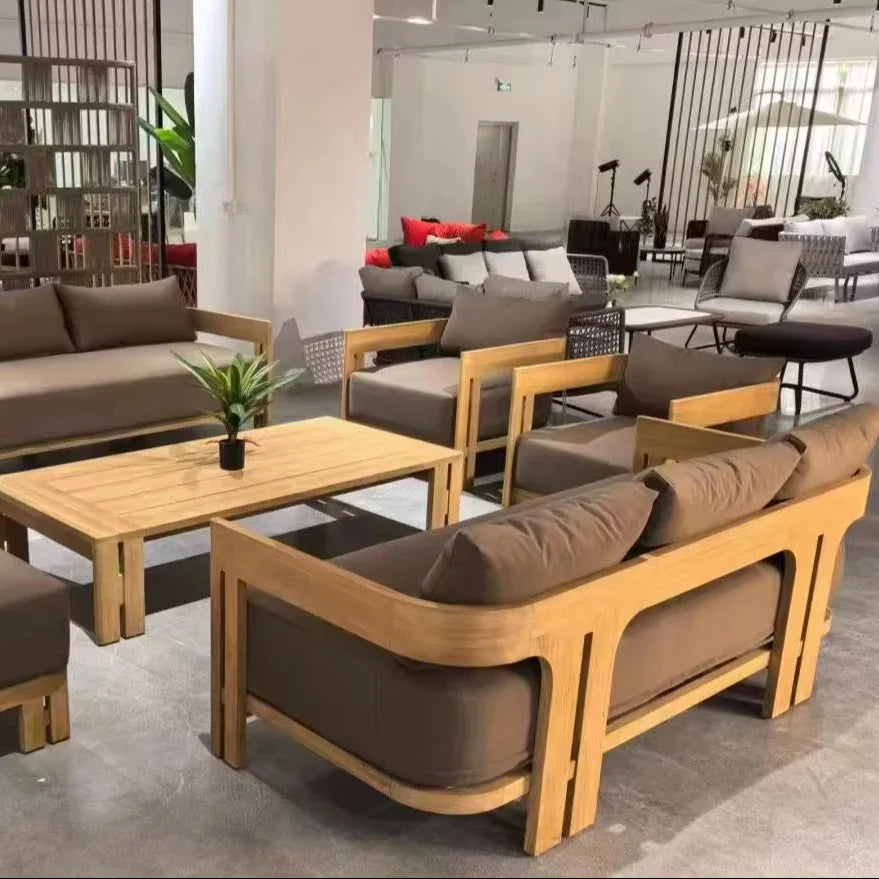 Outdoor furniture set with wooden frames and brown cushions in a modern setting.