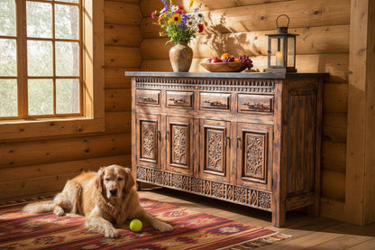 A rustic carved wooden sideboard cabinet with five drawers on top, four doors below, and ornate decorative panels, shown against a plain white background.