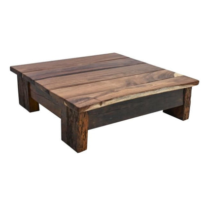 Wooden coffee table with a rustic finish on a white background