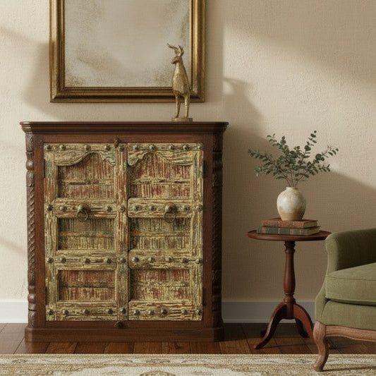 Decorative wooden cabinet with a textured finish in a room with a green chair and small table.