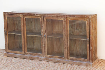 Wooden cabinet with glass doors on a white background