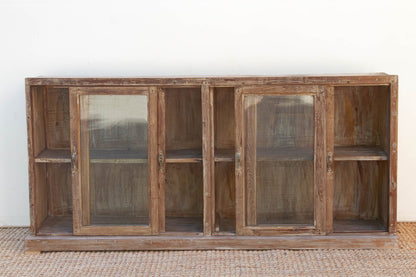 Wooden cabinet with glass doors on a white background