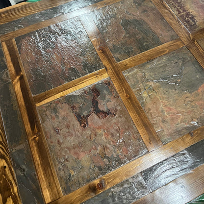 Close-up of a stone floor with wooden border