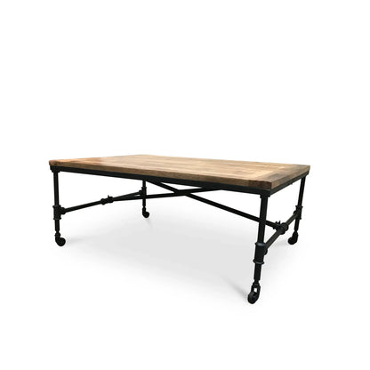 Hand-crafted mango wood coffee table showing reclaimed wood planks and salvaged factory iron frame