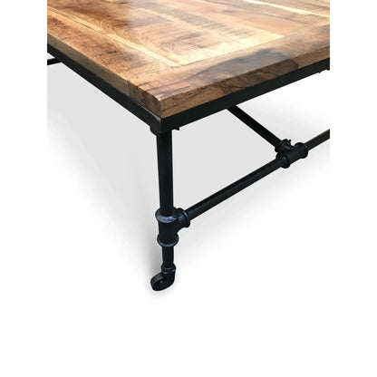 Reclaimed mango wood coffee table showing unique patina with nicks and exposed knots