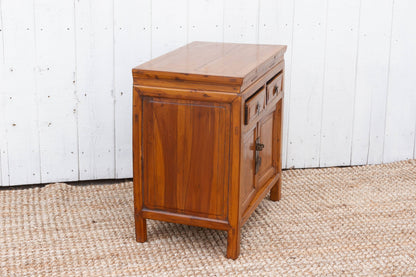 Wooden cabinet with a white wooden panel background