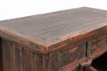 Vintage wooden desk with a worn surface on a white background