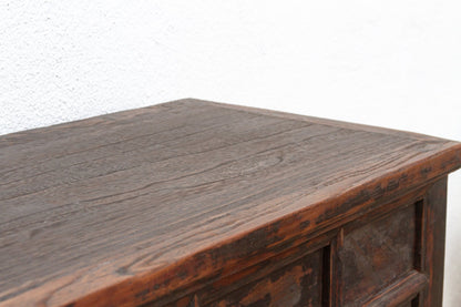 Close-up of a wooden surface with visible grain and texture on a white background