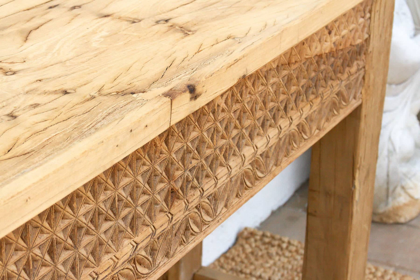 Wooden console table with wicker pattern and natural finish