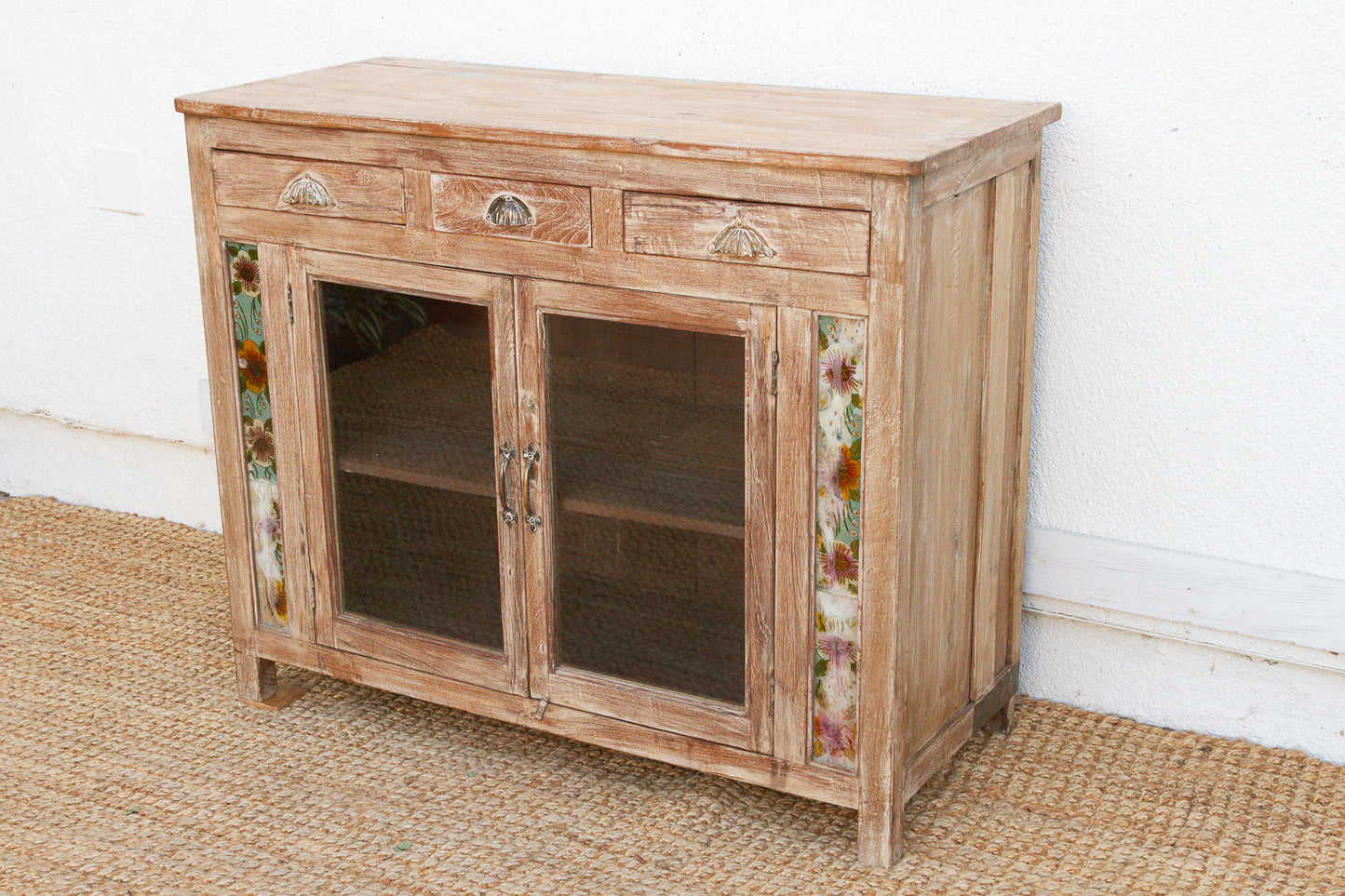 Antique buffet cabinet with hand-painted reverse glass panel detail