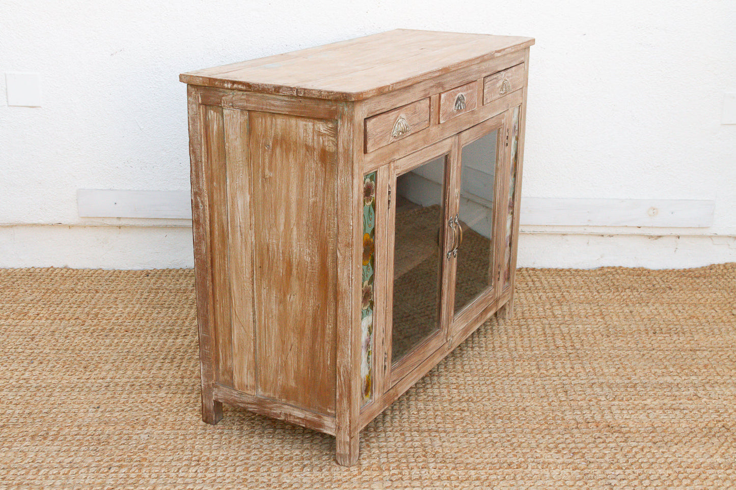 Interior storage view of early 20th century reverse glass buffet cabinet