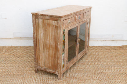 Interior storage view of early 20th century reverse glass buffet cabinet