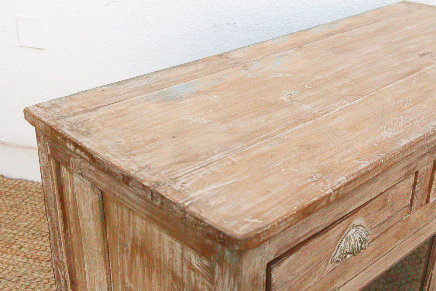 Reverse glass painted buffet cabinet showing rich wood grain and patina