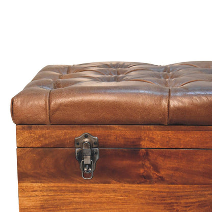 Buffalo Hide Chestnut Storage Trunk with button-tufted leather top and sturdy latch closure.