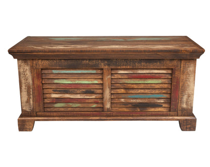 A rustic wooden storage chest with a weathered brown finish and colorful distressed accents on the louvered front doors, shown against a plain white background.