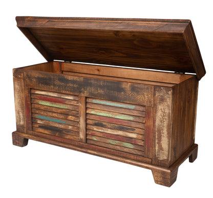 A rustic wooden storage chest with its lid propped open, featuring distressed dark brown wood panels and slatted doors with painted accents in red, blue, and green, isolated on a white background.