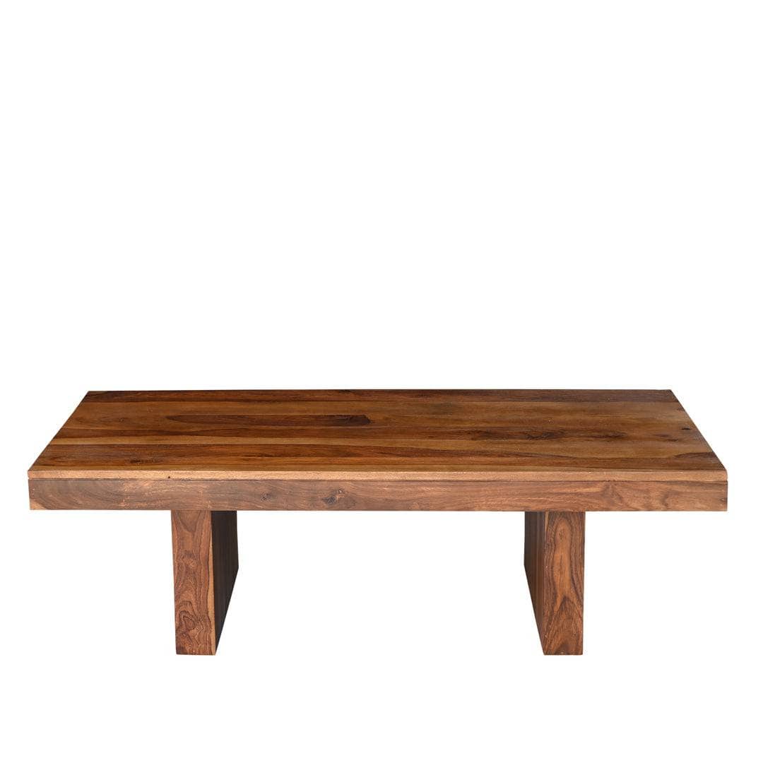 A rectangular wooden coffee table with a thick live-edge top and two blocky legs, shown against a plain white background.