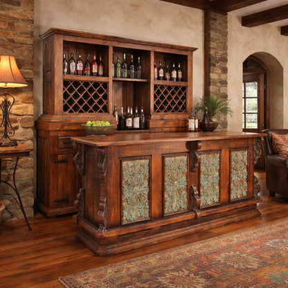 Wooden bar with wine bottles and decorative elements in a rustic room.