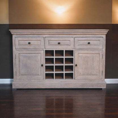 Wooden sideboard with drawers and cabinet doors against a wall.