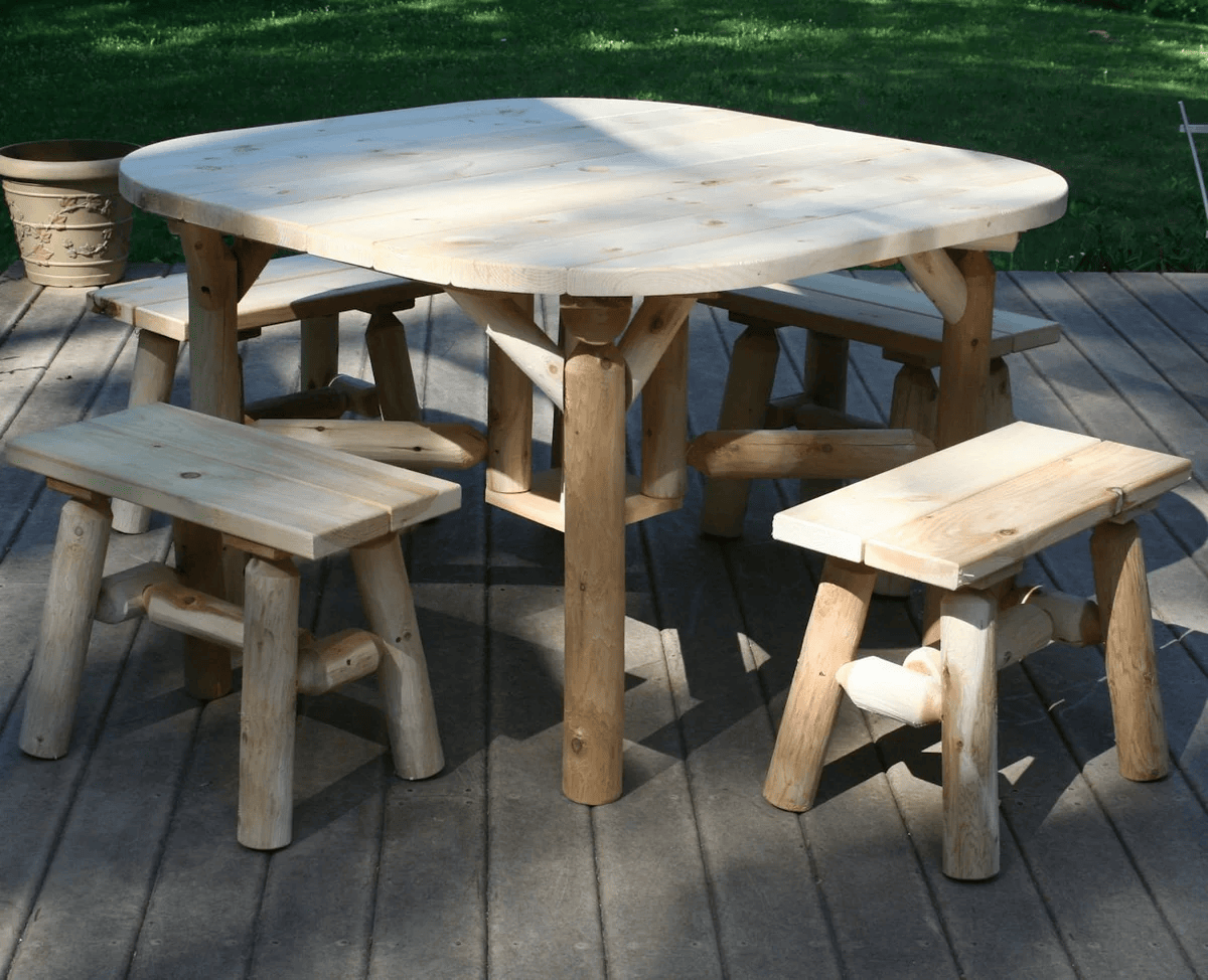 Cedar Log Round Outdoor Table Set featuring a round tabletop and benches, perfect for outdoor gatherings and rustic decor.