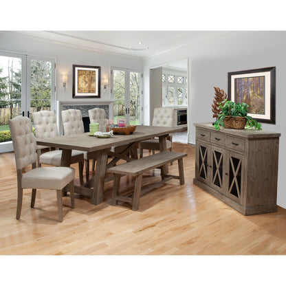 Dining room with wooden table, chairs, and sideboard in a well-lit room.